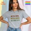 We’re Here, We’re Queer_sporting grey t-shirt